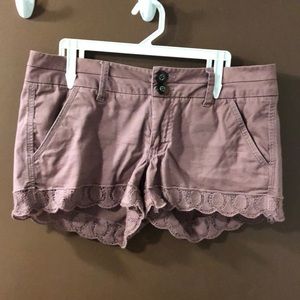 Mauve shorts with embroidered hem.